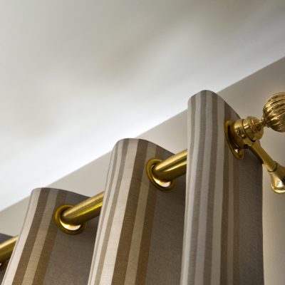 Brass curtain rod in a house