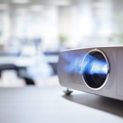 LCD video projector at business conference or lecture in office with copy space