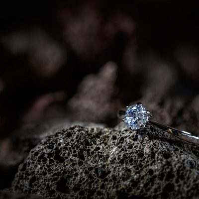 Ring decorated with crystal lying on rock